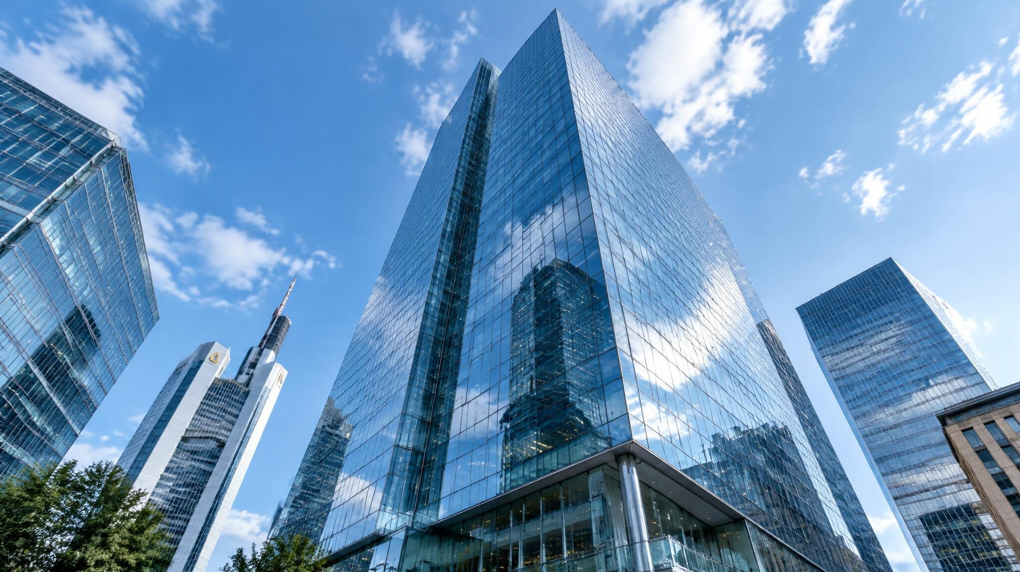Modern glass corporate office tower in a European financial district