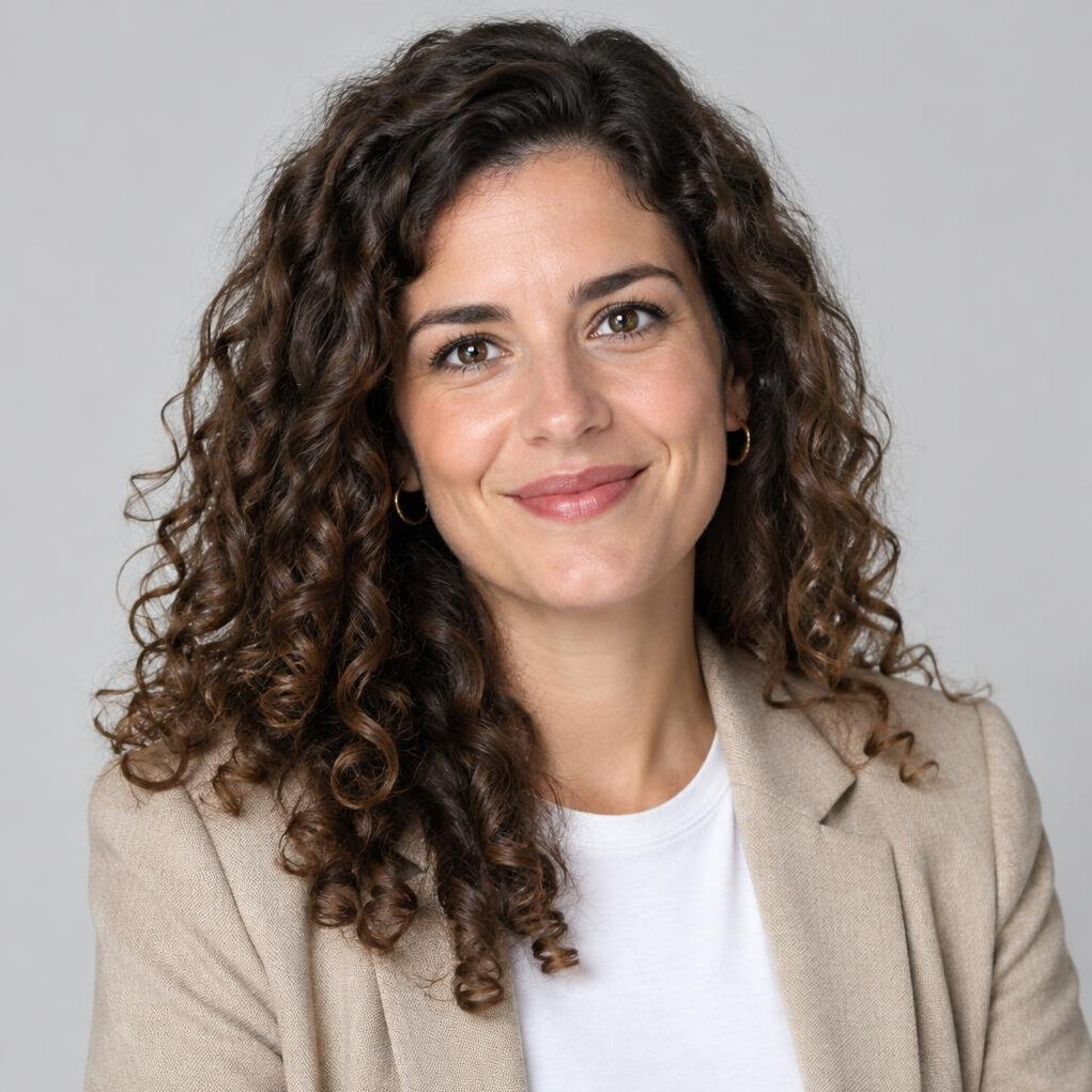 Portrait of a young Portuguese woman data journalist with curly hair